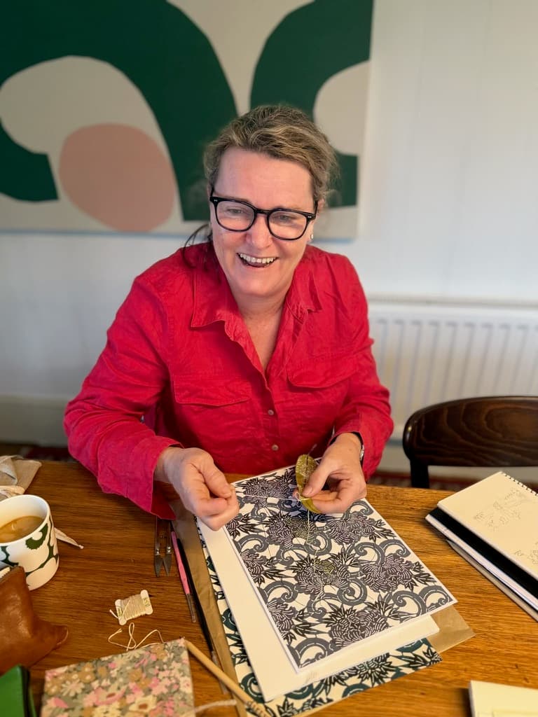 Artist showing intricate pen and ink work at the retreat