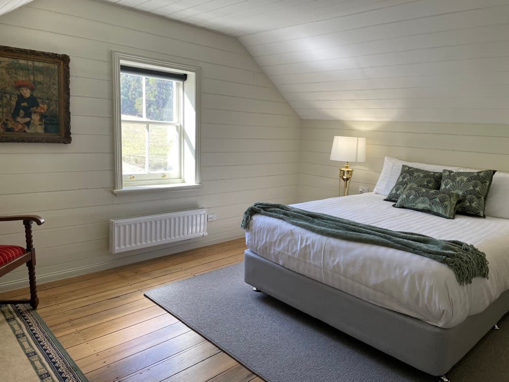 Charming attic queen bedroom with natural light — The Cottage at Flowerpot, Southern Tasmania