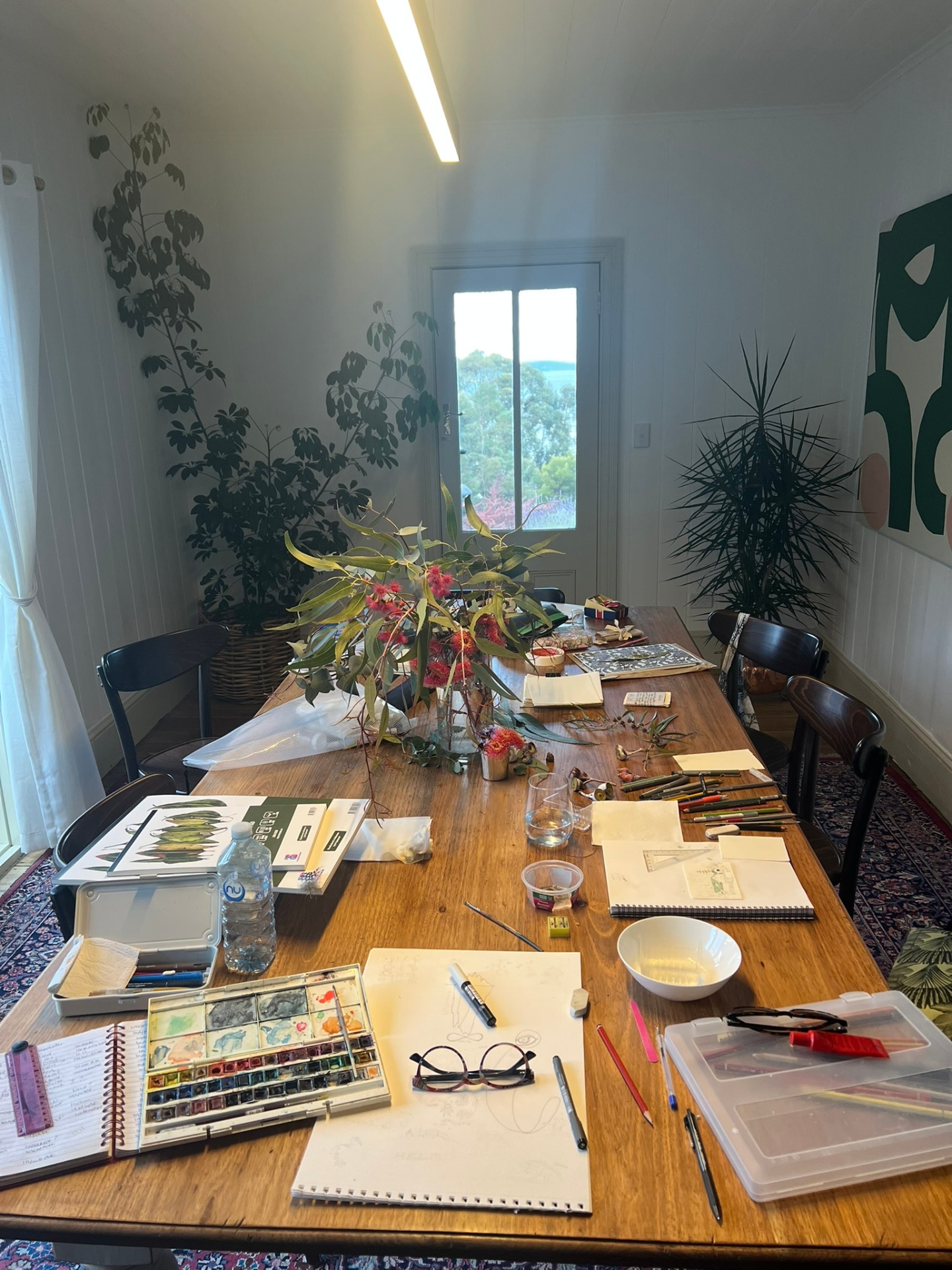 Art retreat workspace set up in the dining room with Channel views