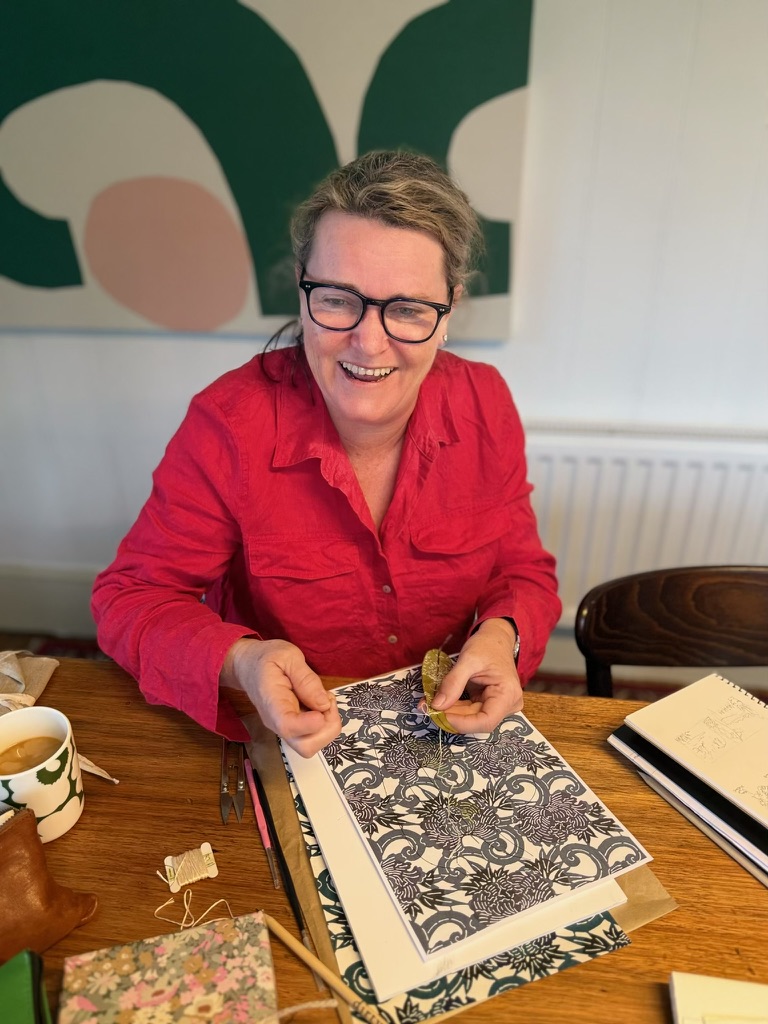 Artist showing intricate pen and ink work at the retreat