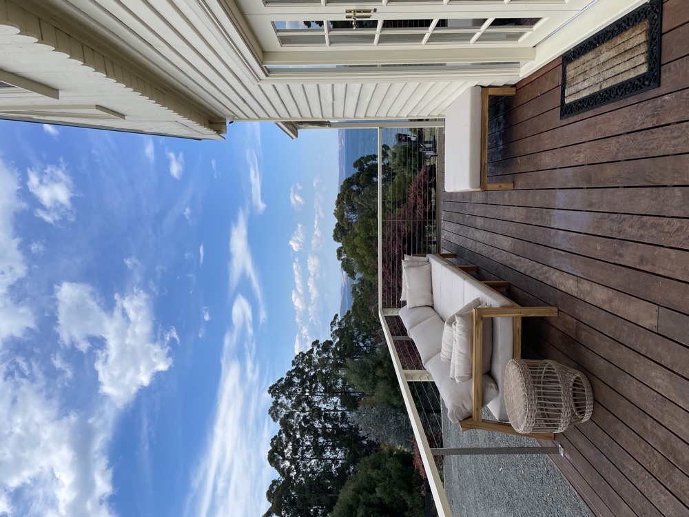 Second living area with white sofa — The Cottage at Flowerpot, Southern Tasmania